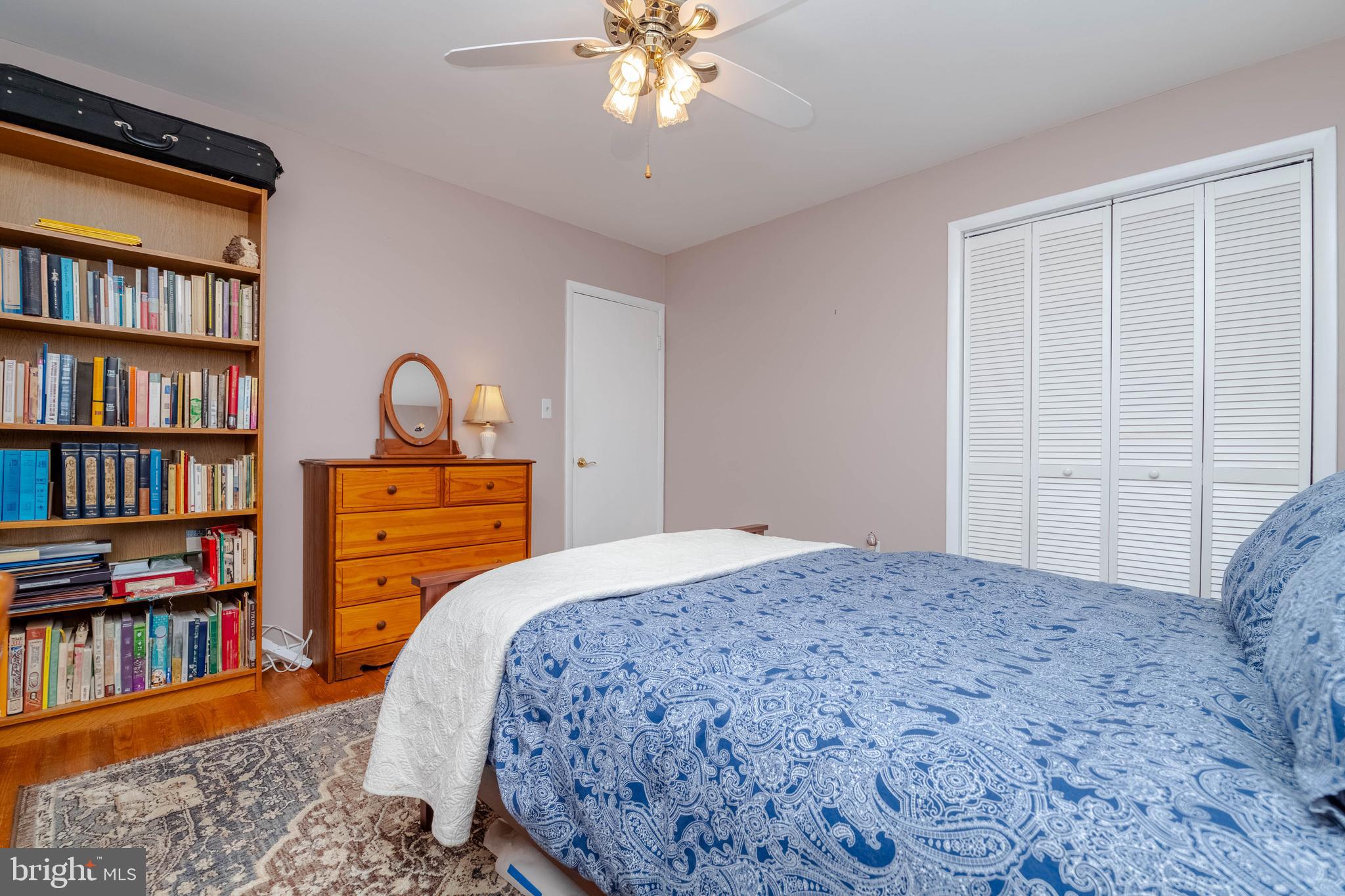 8600 Saddler Road Parkville, MD 21234 - Photo 26 of 39 a bedroom with a bed furniture and a book shelf