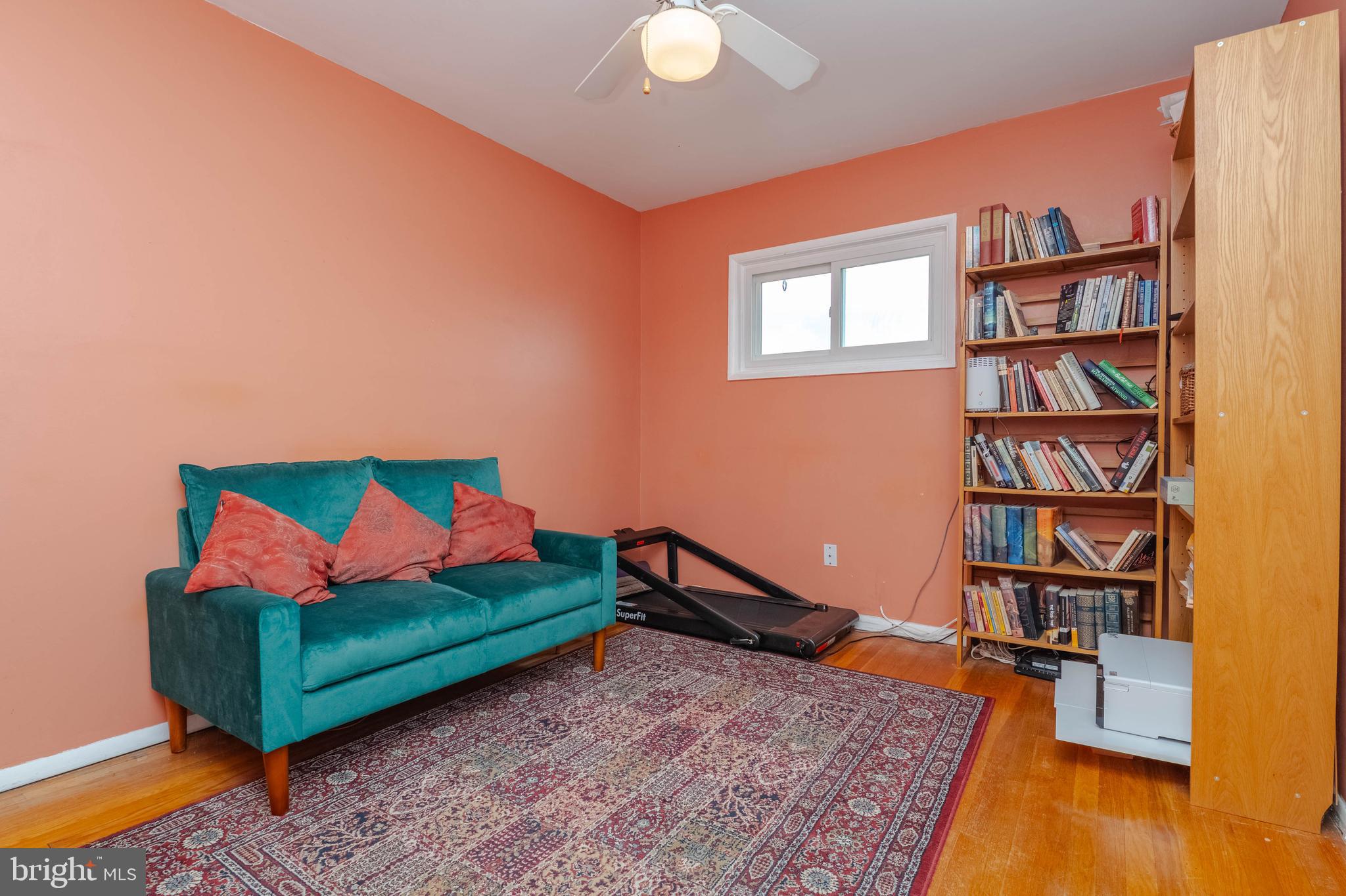 8600 Saddler Road Parkville, MD 21234 - Photo 27 of 39 a living room with furniture and a book shelf