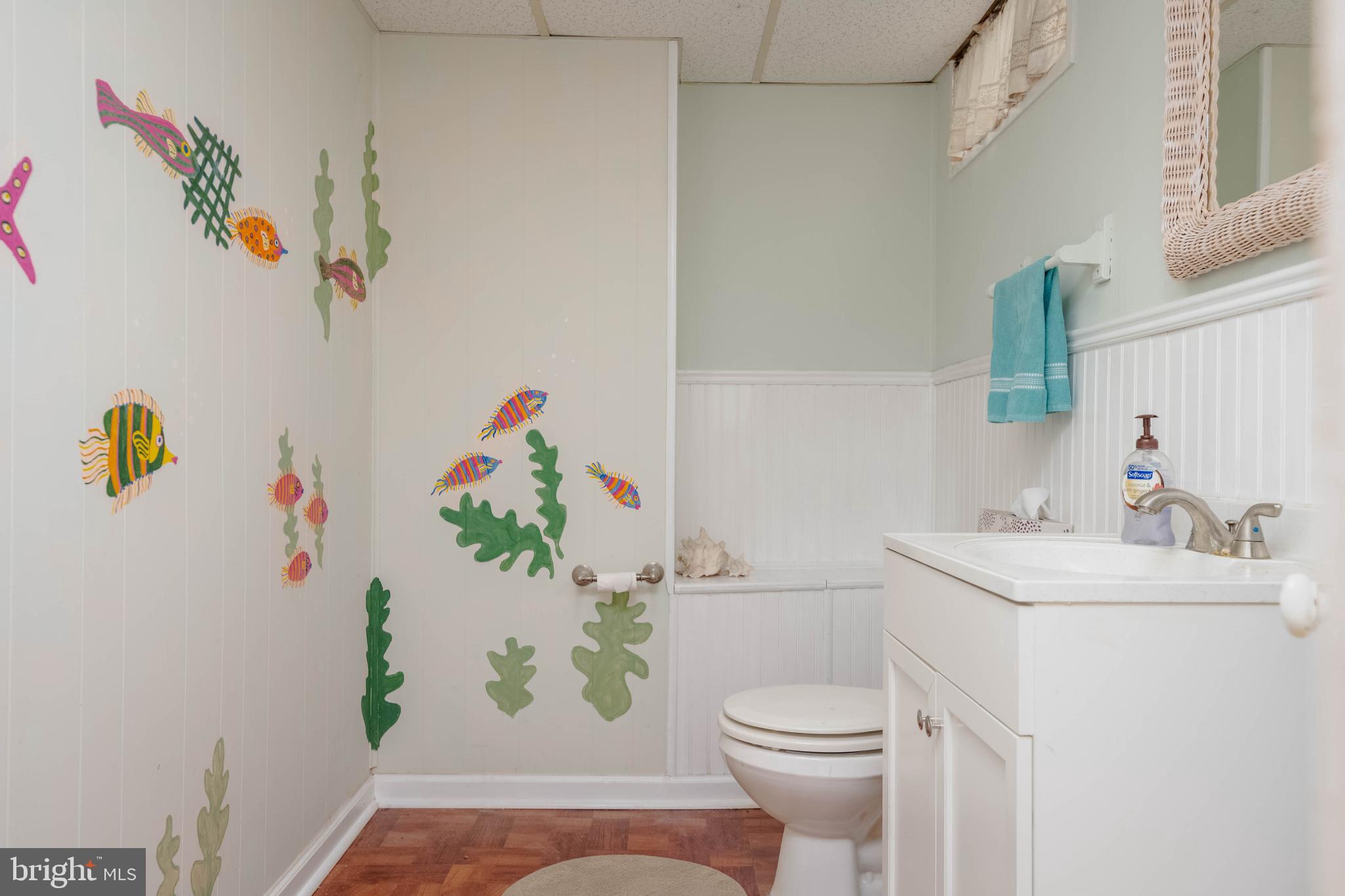 8600 Saddler Road Parkville, MD 21234 - Photo 30 of 39 a bathroom with a sink a toilet and a shower curtain