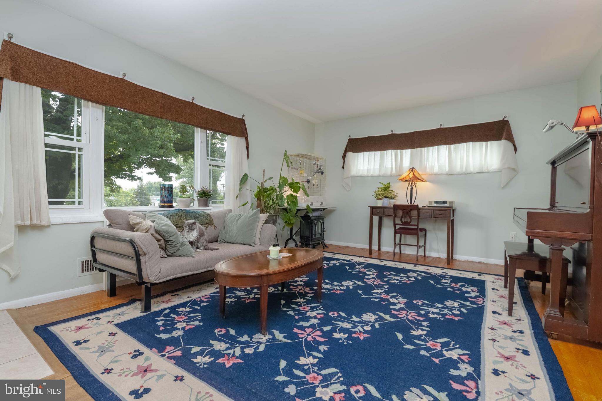 8600 Saddler Road Parkville, MD 21234 - Photo 3 of 39 a living room with furniture a rug a lamp and a large window