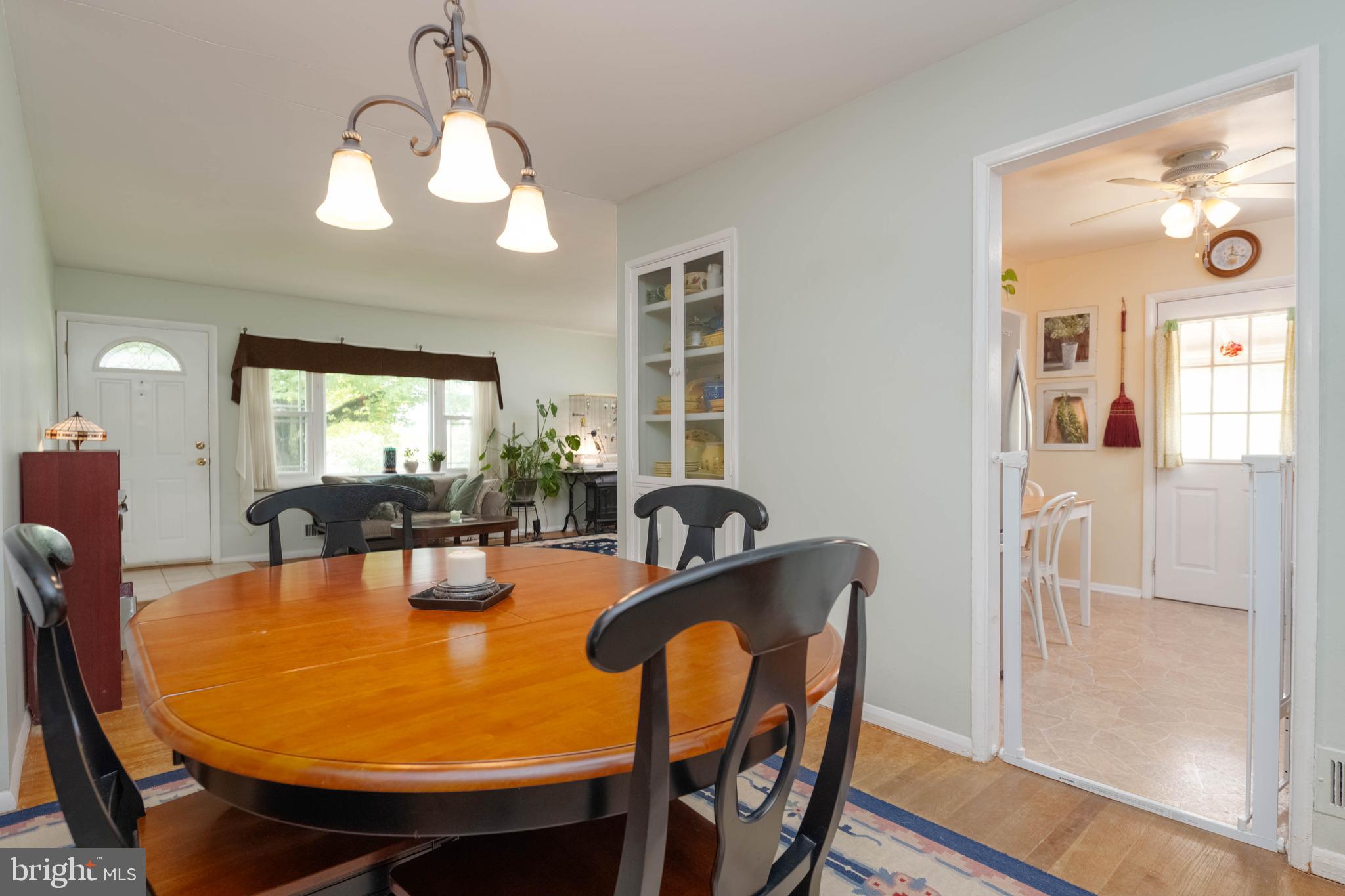 8600 Saddler Road Parkville, MD 21234 - Photo 8 of 39 a view of a dining room with furniture and wooden floor