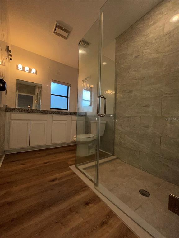 755 South Narcoossee Road St. Cloud, FL 34771 - Photo 16 of 44 a bathroom with a sink shower and a mirror