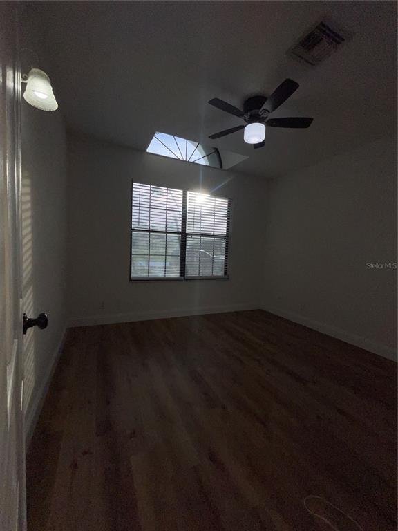 755 South Narcoossee Road St. Cloud, FL 34771 - Photo 20 of 44 wooden floor in an empty room with a window
