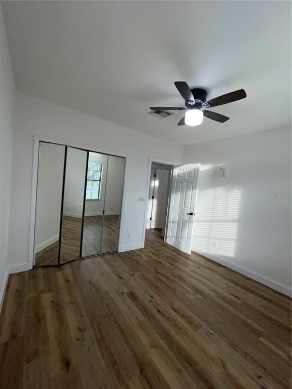 755 South Narcoossee Road St. Cloud, FL 34771 - Photo 22 of 44 a view of empty room with wooden floor