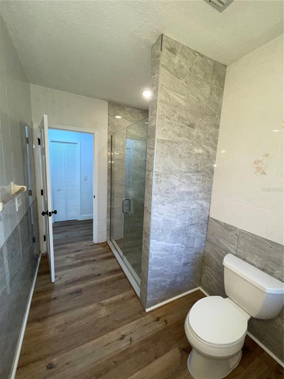 755 South Narcoossee Road St. Cloud, FL 34771 - Photo 25 of 44 a bathroom with a toilet and a shower