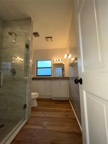 a bathroom with a sink and shower