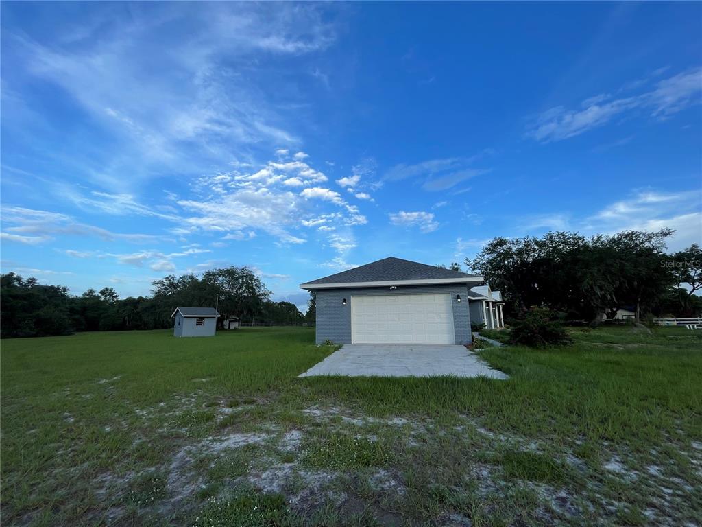 755 South Narcoossee Road St. Cloud, FL 34771 - Photo 3 of 44 a view of a backyard with green space