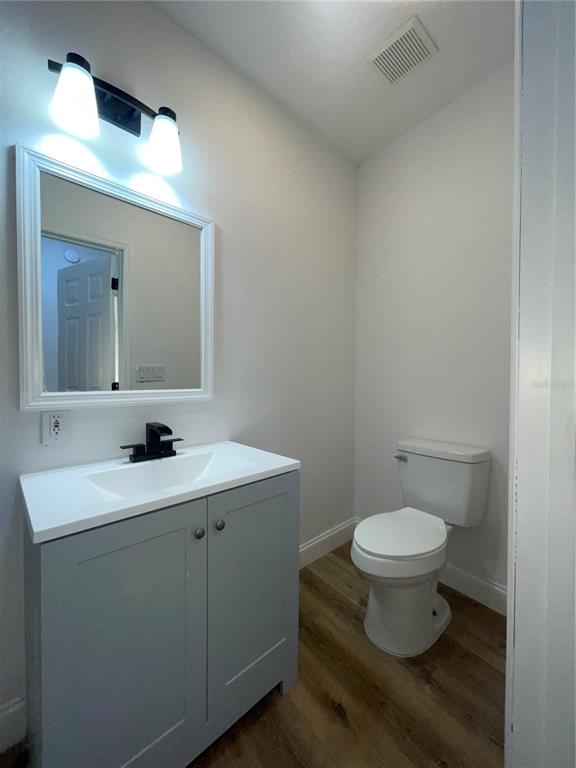 755 South Narcoossee Road St. Cloud, FL 34771 - Photo 33 of 44 a bathroom with a toilet sink and mirror