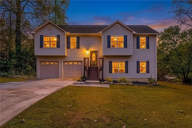 a front view of residential houses with yard