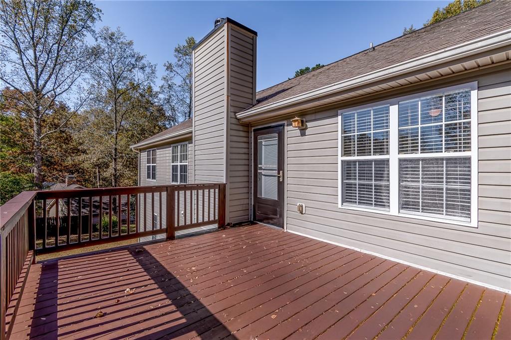 5014 Red Oak Lane Gainesville, GA 30506 - Photo 14 of 43 a view of a deck with wooden floor and fence next to a yard
