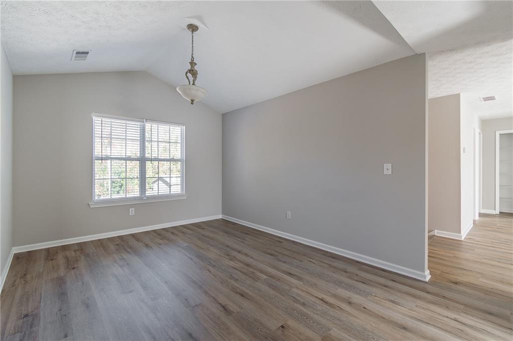5014 Red Oak Lane Gainesville, GA 30506 - Photo 20 of 43 a view of an empty room with wooden floor and a window