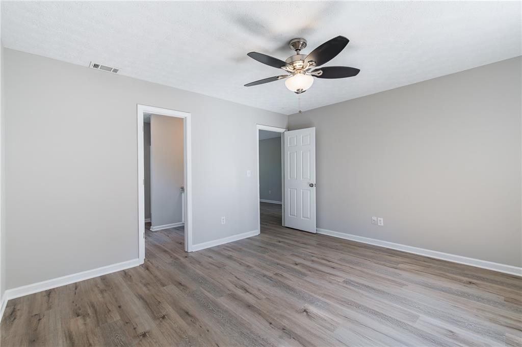 5014 Red Oak Lane Gainesville, GA 30506 - Photo 23 of 43 a view of an empty room with wooden floor