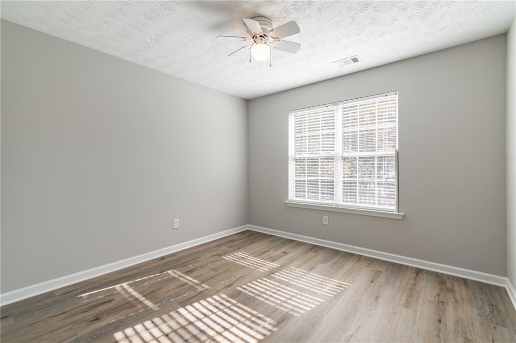 5014 Red Oak Lane Gainesville, GA 30506 - Photo 28 of 43 a view of an empty room with a window