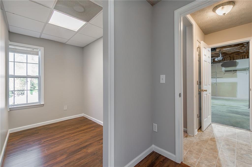 5014 Red Oak Lane Gainesville, GA 30506 - Photo 35 of 43 an empty room with wooden floor closet and windows