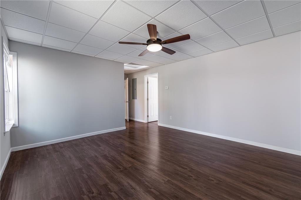 5014 Red Oak Lane Gainesville, GA 30506 - Photo 37 of 43 a view of an empty room with window and wooden floor