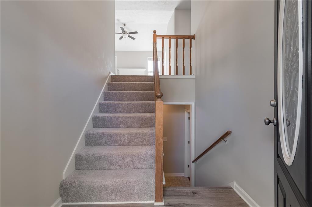 5014 Red Oak Lane Gainesville, GA 30506 - Photo 8 of 43 a view of staircase with white walls and a window