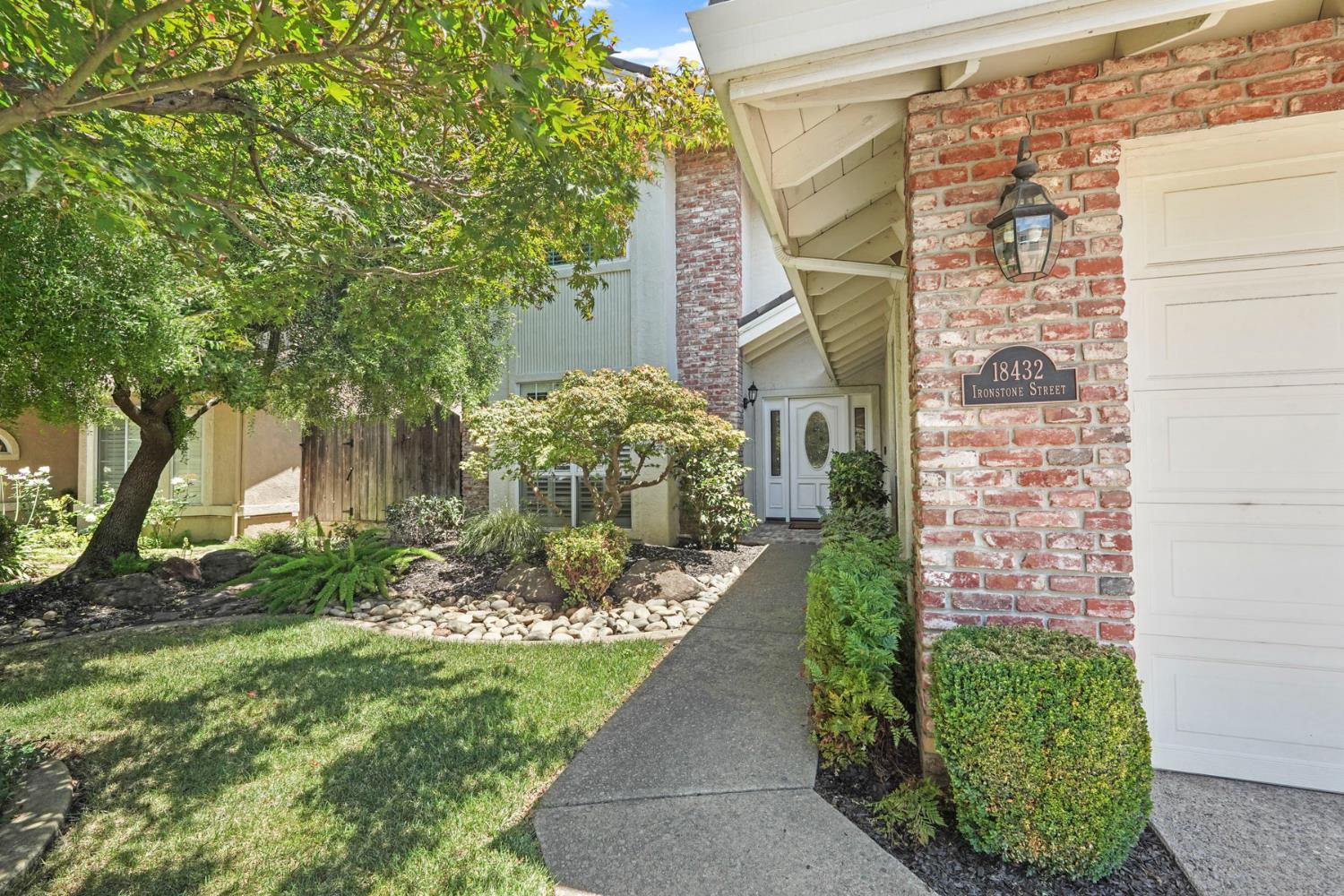18432 Ironstone Street Woodbridge, CA 95258 - Photo 5 of 50 The manicured landscape and brick accents compliment the home nicely.