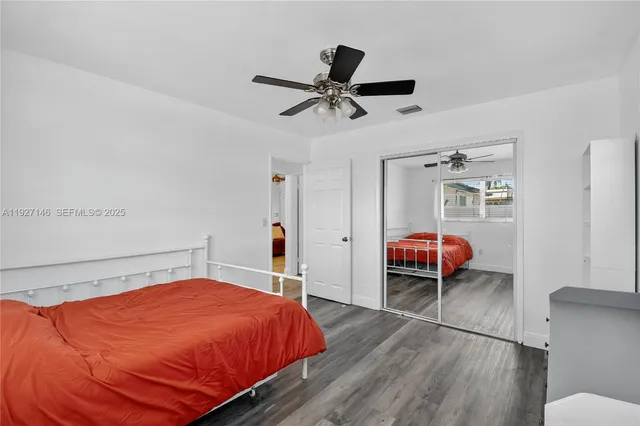 a view of a livingroom with a fireplace and window