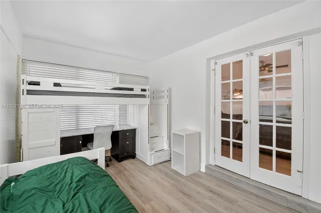 a living room with a bed and a fireplace