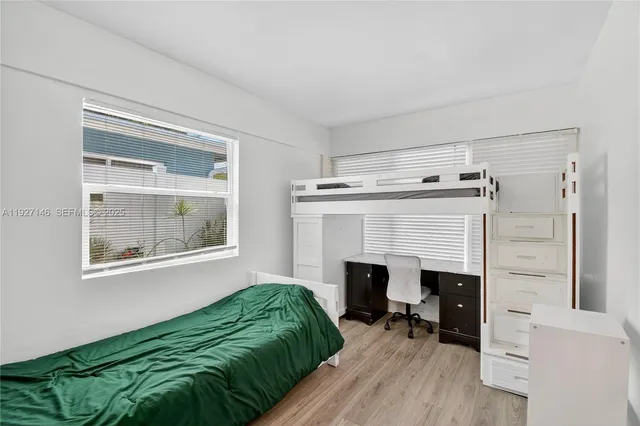 a kitchen with stainless steel appliances granite countertop a refrigerator and a stove