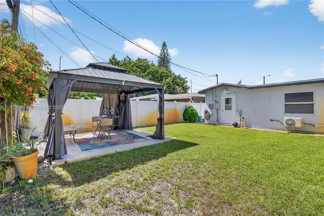 a vase of flowers sitting on a floor