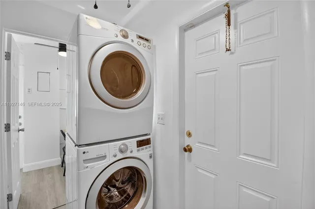 a view of a hallway with washer and dryer