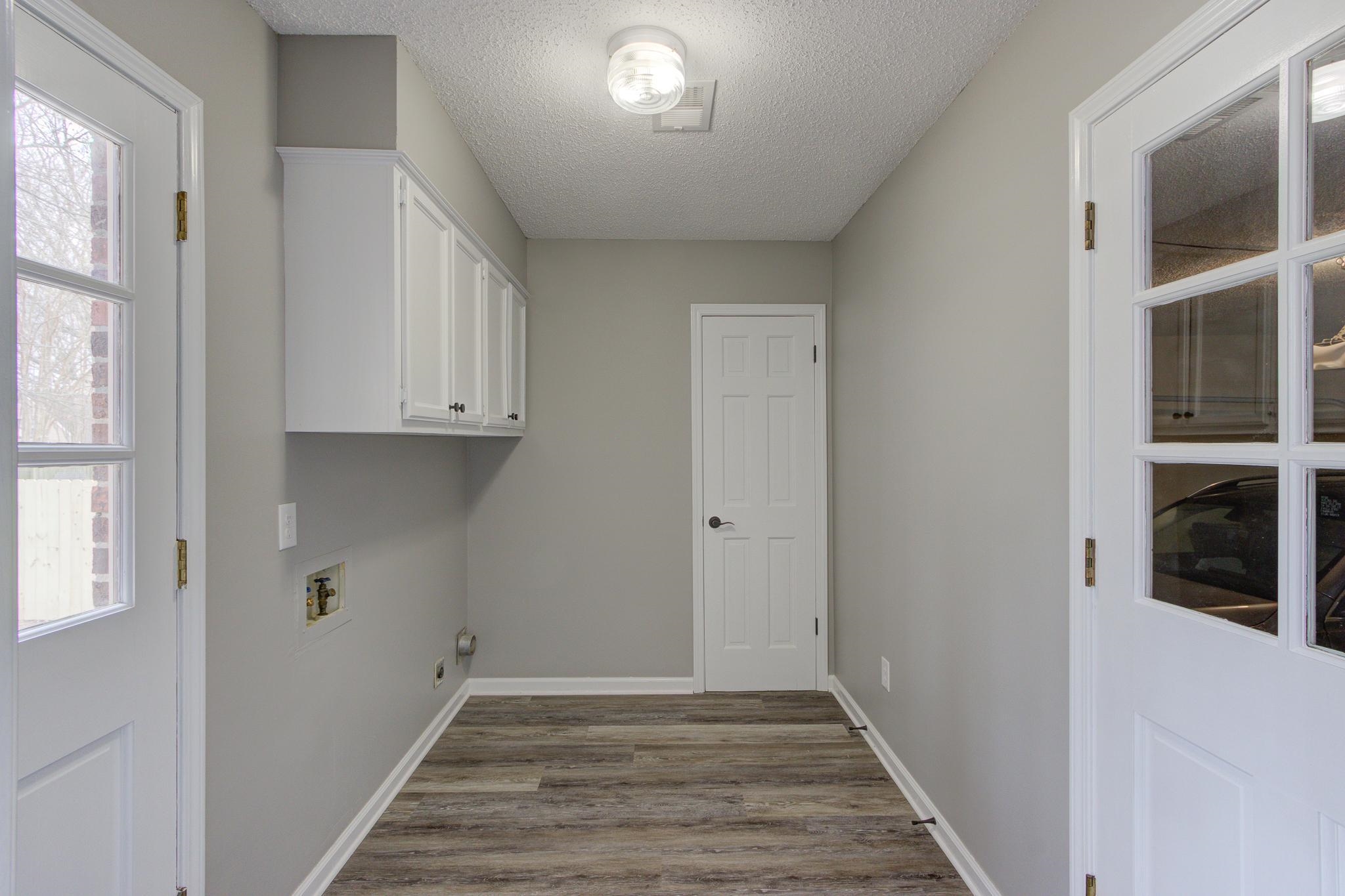 5991 Explorer Road Bartlett, TN 38134 - Photo 18 of 39 Laundry room with extra cabinets and pantry closet.