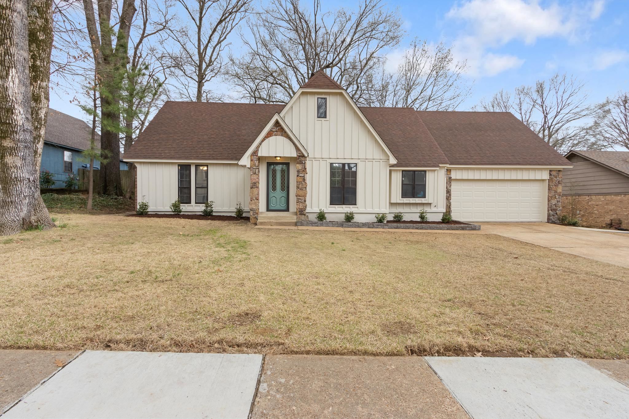 5991 Explorer Road Bartlett, TN 38134 - Photo 2 of 39 Modern farmhouse with a front lawn, roof with shingles, board and batten siding, and driveway