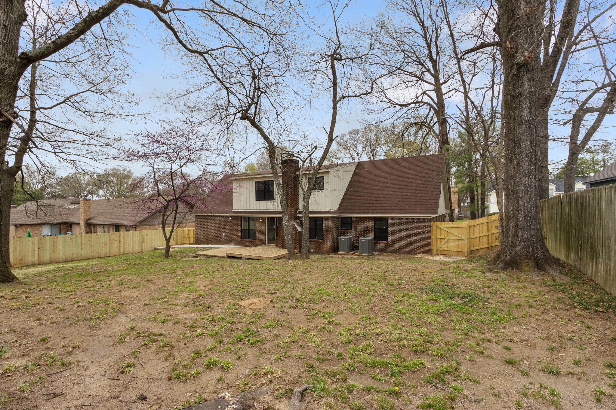 5991 Explorer Road Bartlett, TN 38134 - Photo 39 of 39 Rear view of house featuring a deck and concrete patio with walkway.