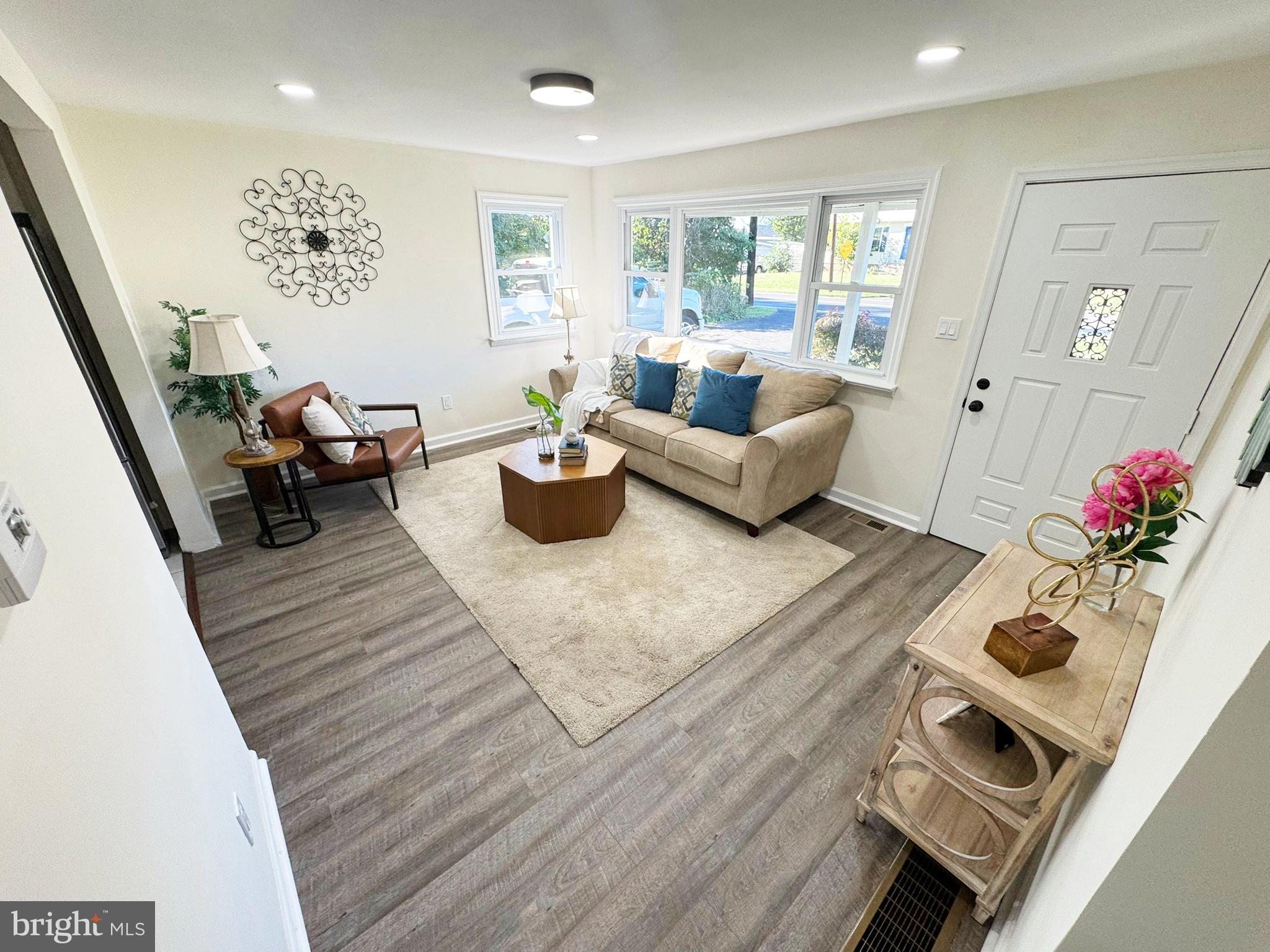 1210 Brownsville Road Langhorne, PA 19047 - Photo 2 of 13 a living room with furniture or couch and a potted plant
