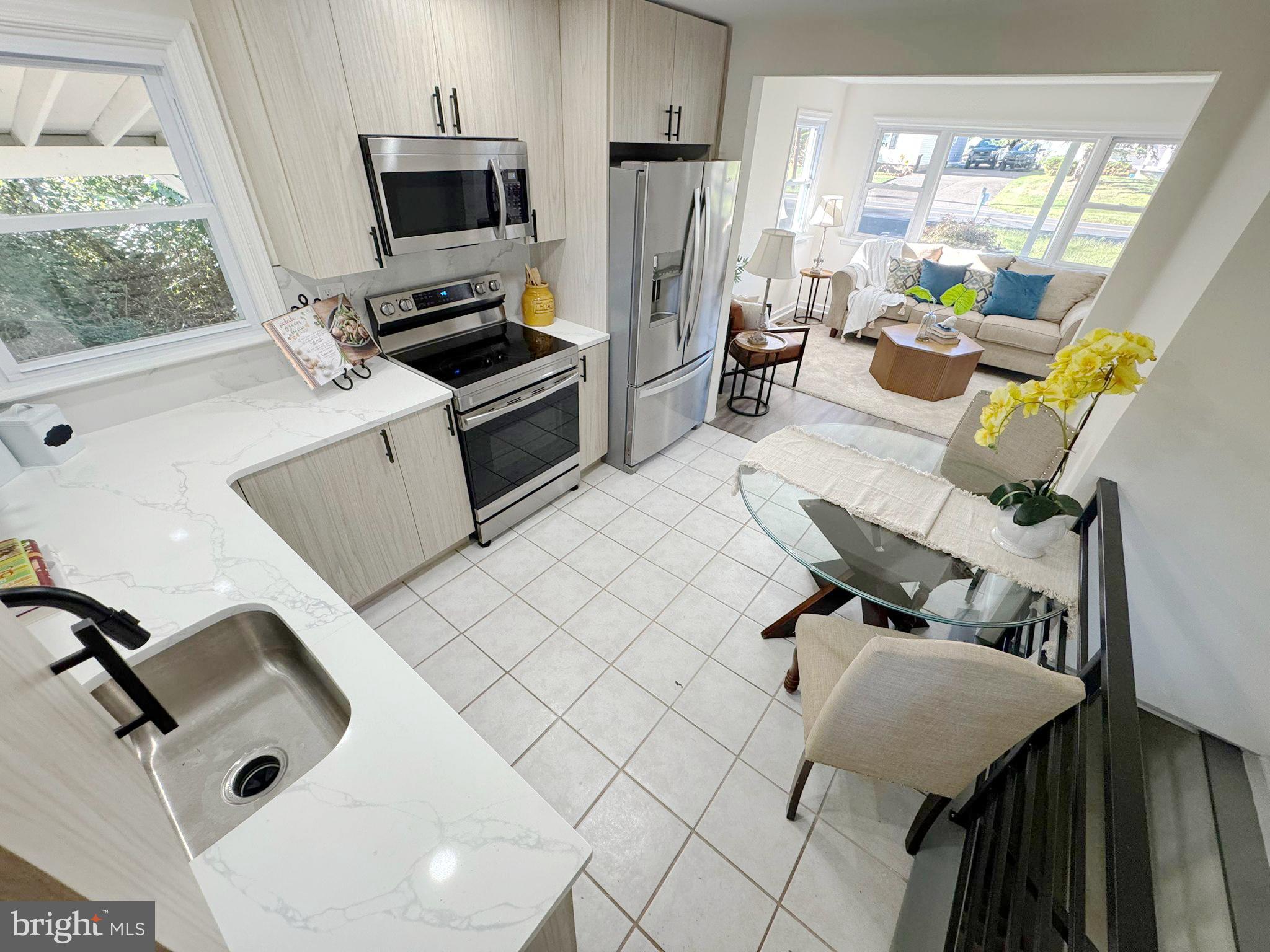 1210 Brownsville Road Langhorne, PA 19047 - Photo 5 of 13 a kitchen with a sink appliances and cabinets