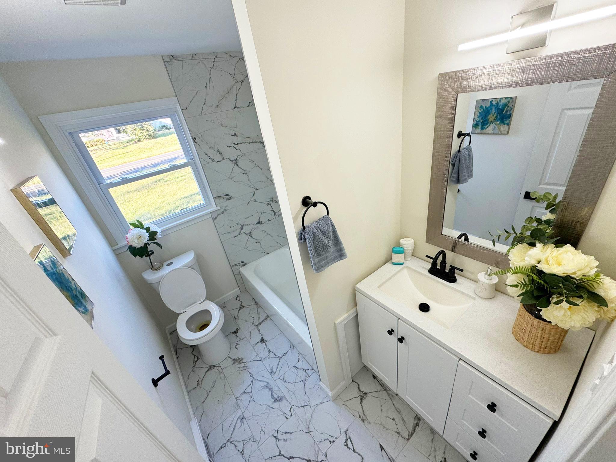 1210 Brownsville Road Langhorne, PA 19047 - Photo 7 of 13 a bathroom with a sink mirror and vanity