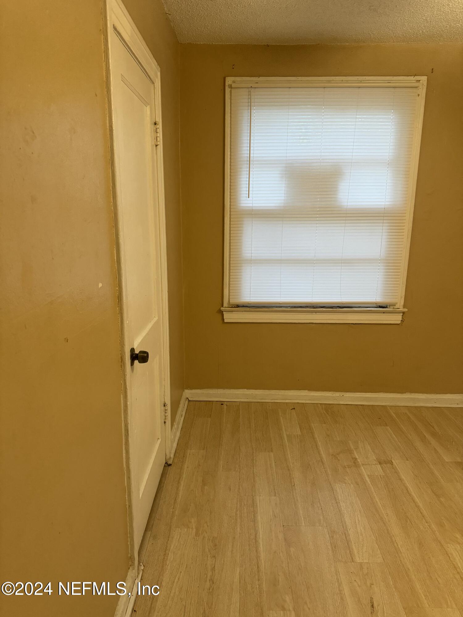 822 Saranac Street Jacksonville, FL 32254 - Photo 4 of 17 a view of an empty room with a window