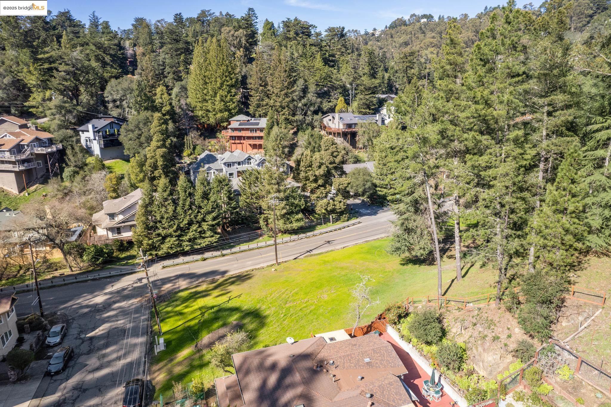 6658 Shepherd Canyon Road Oakland, CA 94611 - Photo 7 of 19 a view of a swimming pool with an outdoor space and seating area