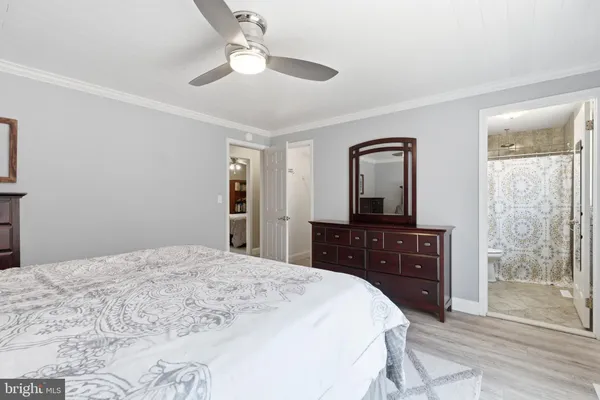 a bathroom with a sink vanity and a mirror