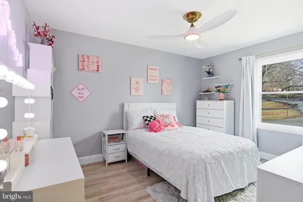 a bedroom with furniture and a bed