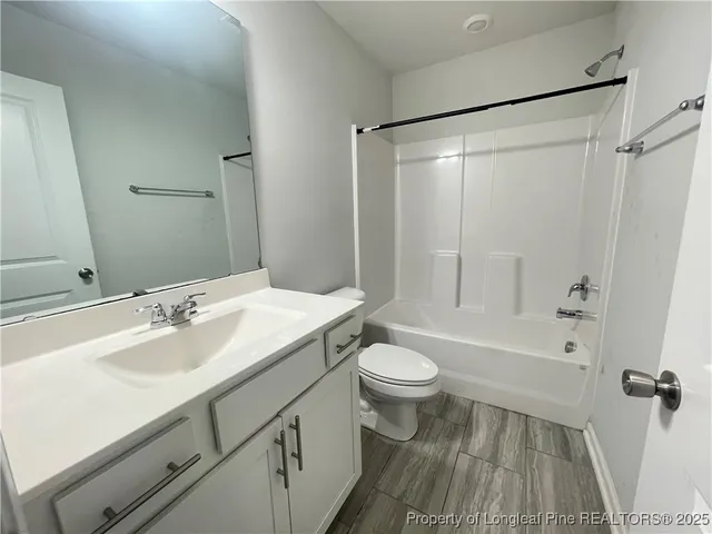 a bathroom with a sink toilet a shower and a mirror