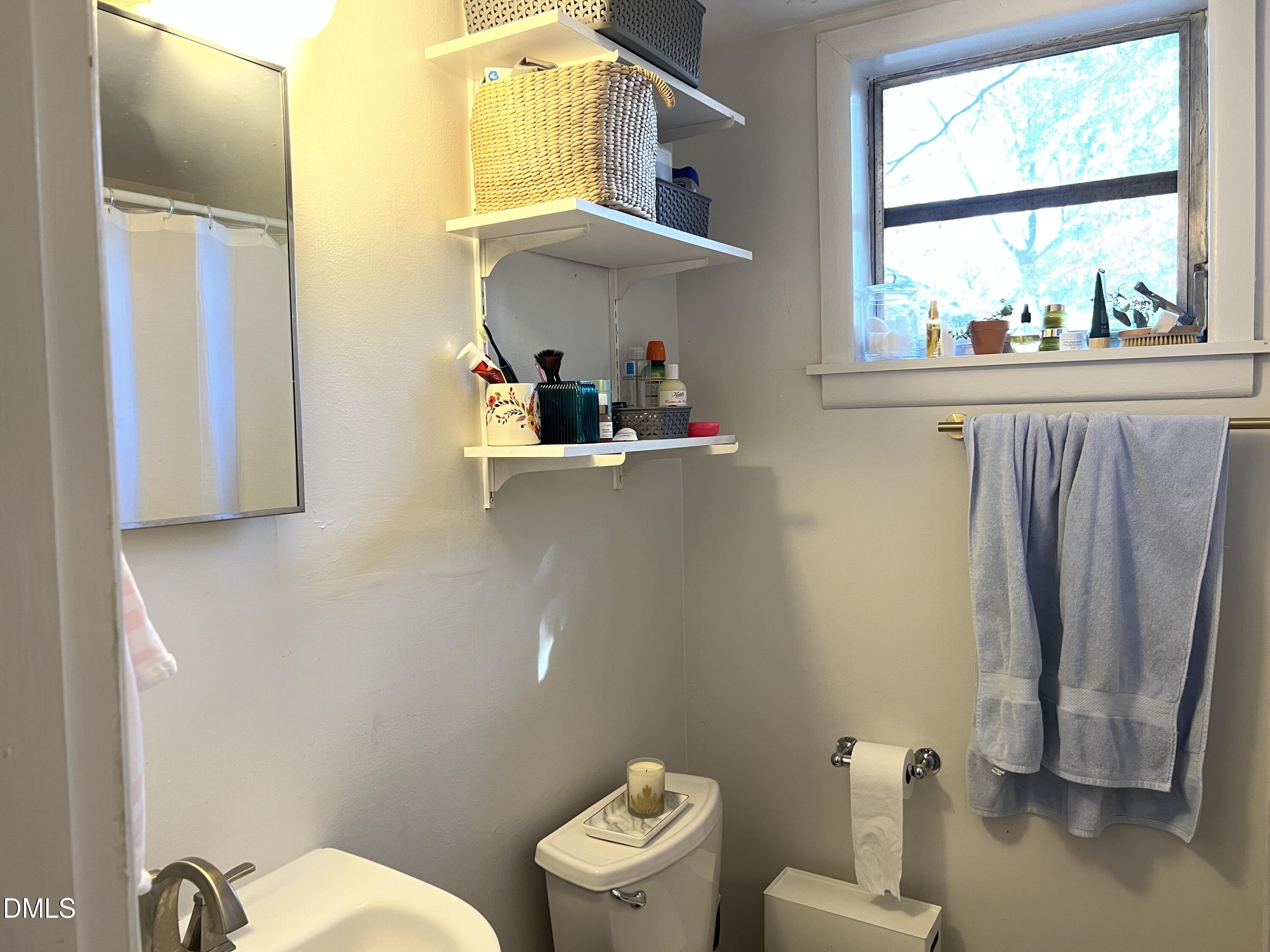 503 Cole Street, Unit 1/2 Raleigh, NC 27605 - Photo 17 of 35 a bathroom with a toilet and a sink