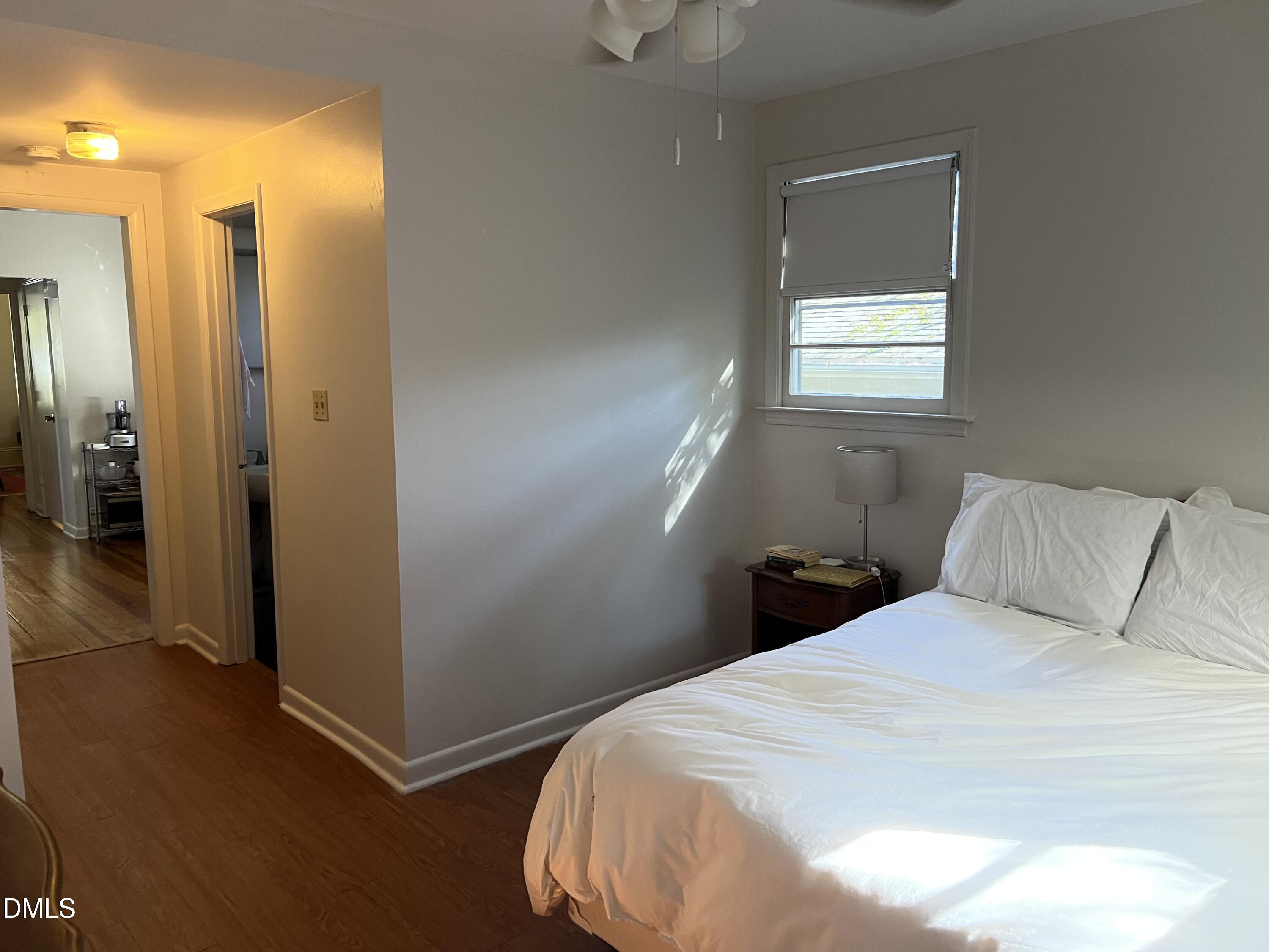 503 Cole Street, Unit 1/2 Raleigh, NC 27605 - Photo 19 of 35 a bedroom with a bed and a window