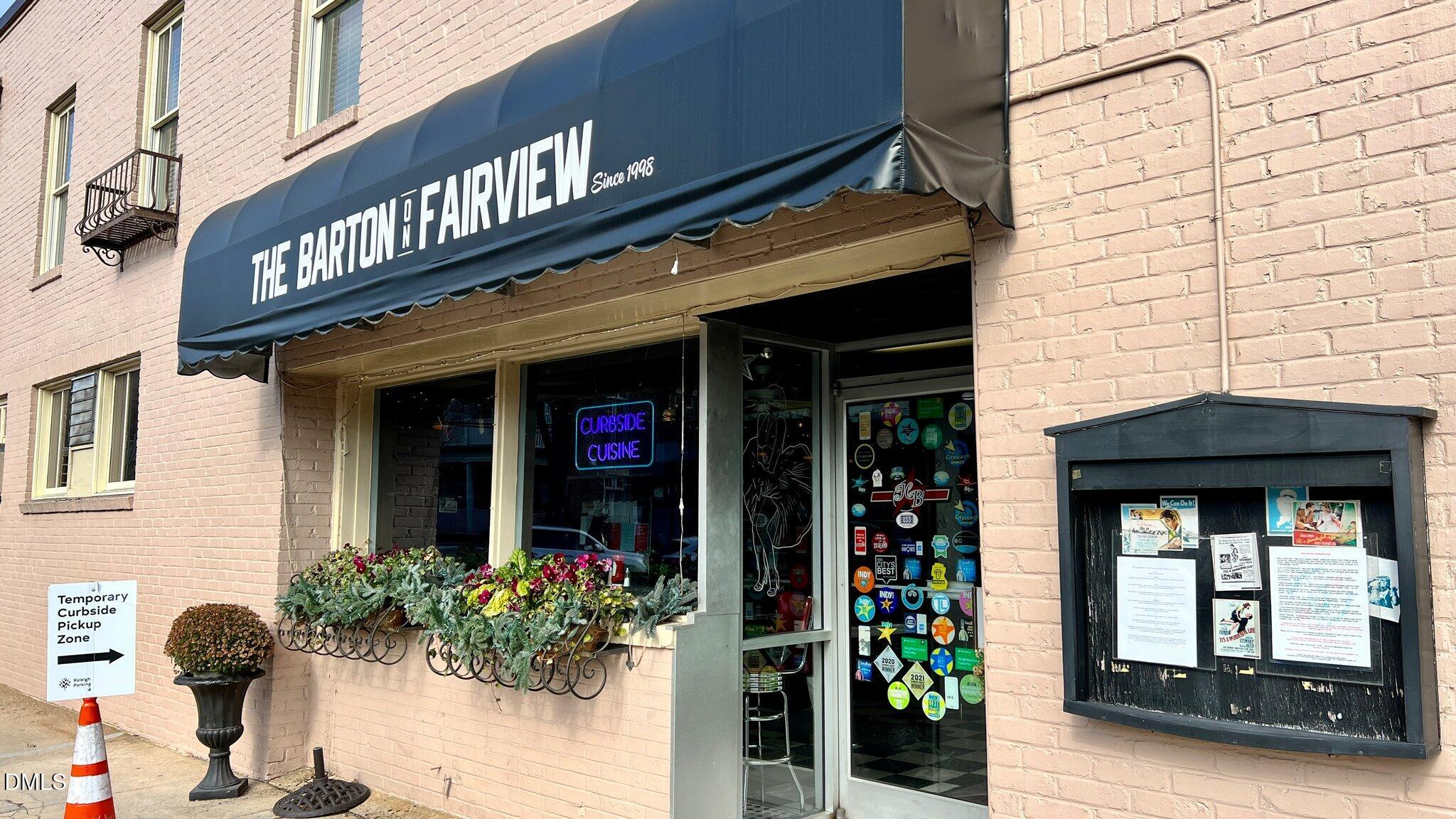 503 Cole Street, Unit 1/2 Raleigh, NC 27605 - Photo 26 of 35 a view of a cafe with the potted plants