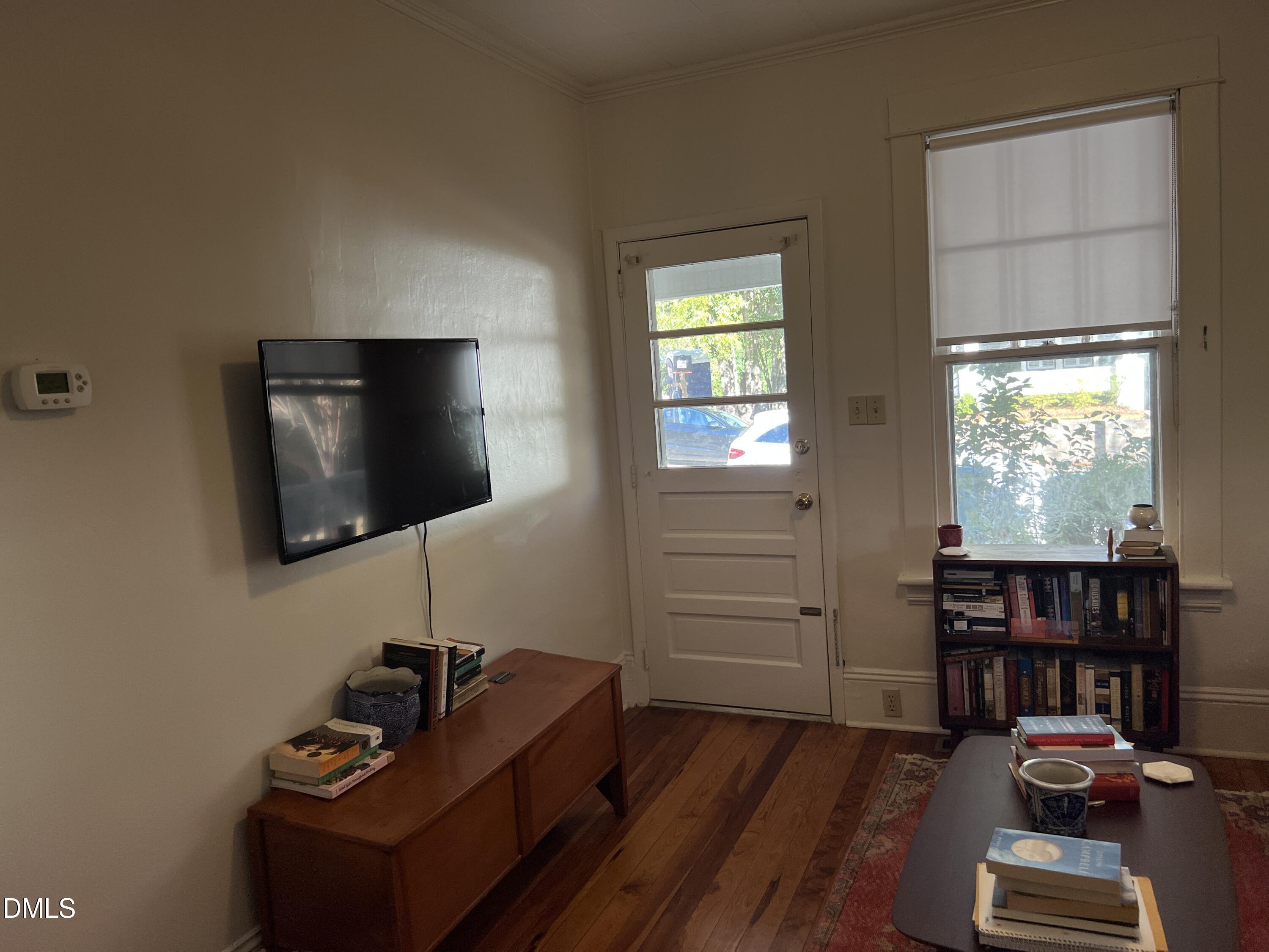 503 Cole Street, Unit 1/2 Raleigh, NC 27605 - Photo 5 of 35 a living room with furniture and a flat screen tv