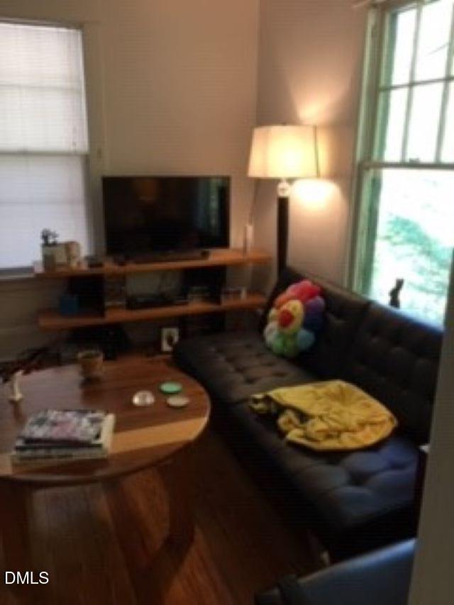 503 Cole Street, Unit 1/2 Raleigh, NC 27605 - Photo 7 of 35 a living room with furniture and a flat screen tv