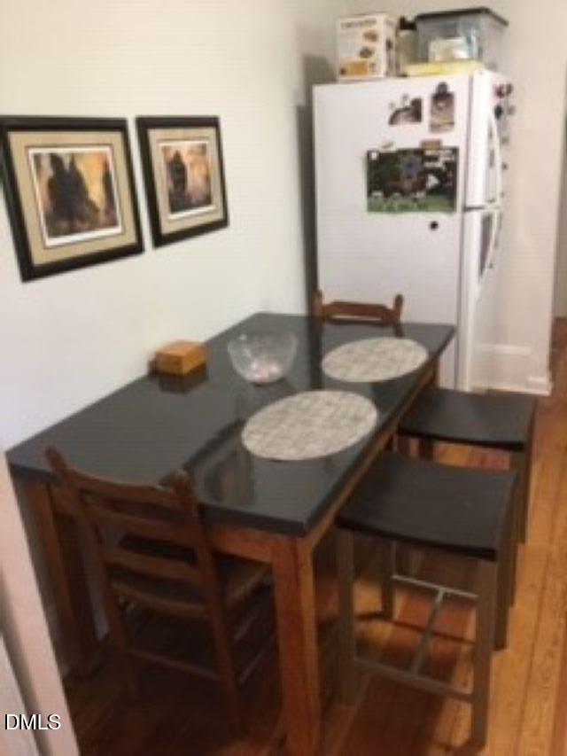 503 Cole Street, Unit 1/2 Raleigh, NC 27605 - Photo 10 of 35 a view of a dining room with furniture and wooden floor