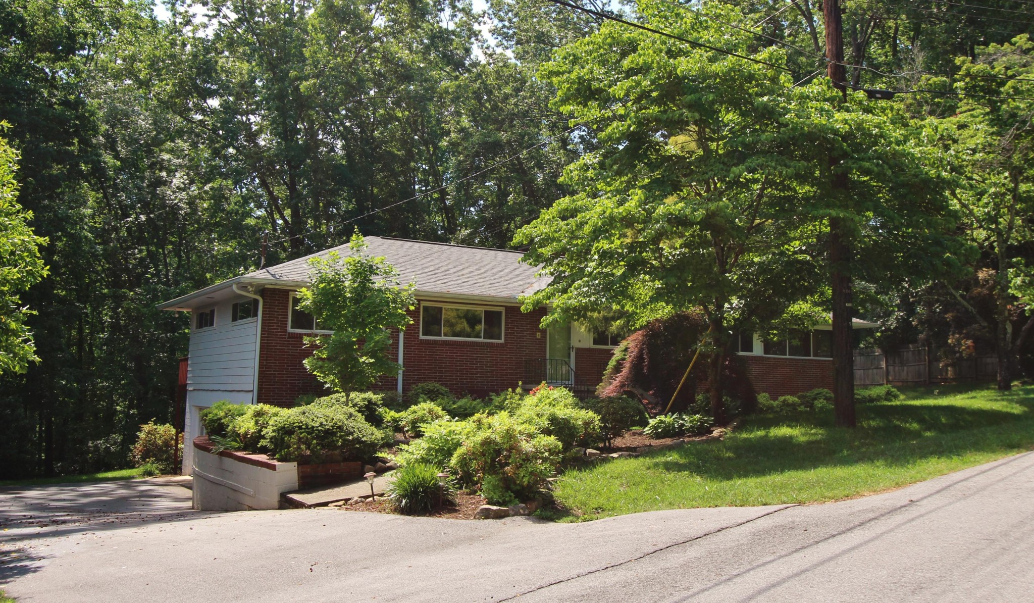 133 North Seneca Road Oak Ridge, TN 37830 - Photo 1 of 35 a front view of a house with garden