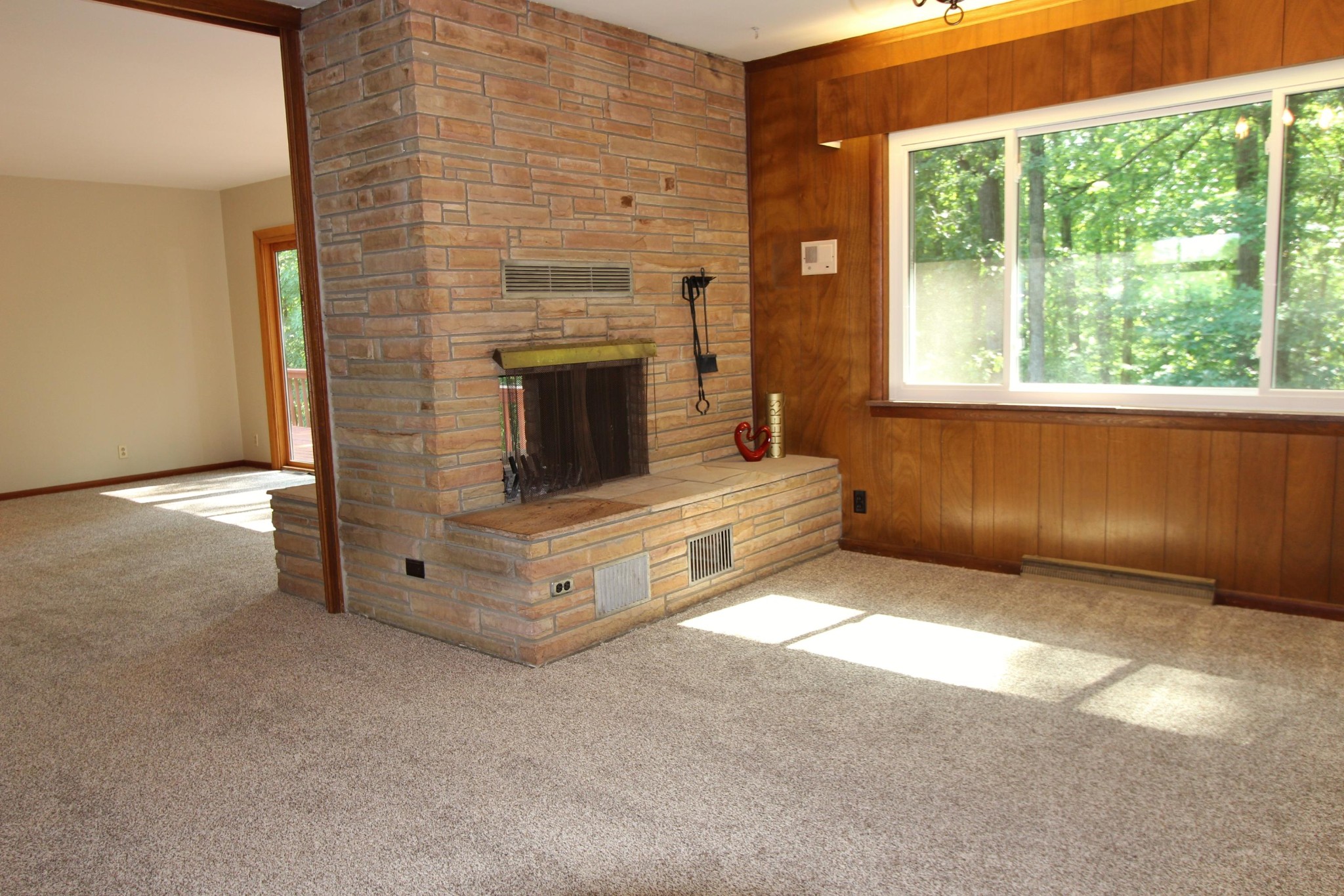133 North Seneca Road Oak Ridge, TN 37830 - Photo 19 of 35 a view of an empty room with a fireplace and a window