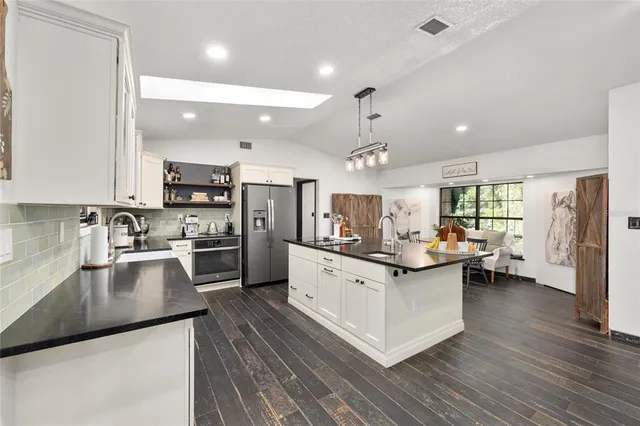 a bathroom with a toilet a sink and a shower