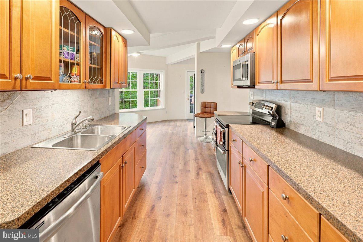 7823 Supinlick Ridge Road Mount Jackson, VA 22842 - Photo 25 of 58 Modern kitchen with warm wood accents.