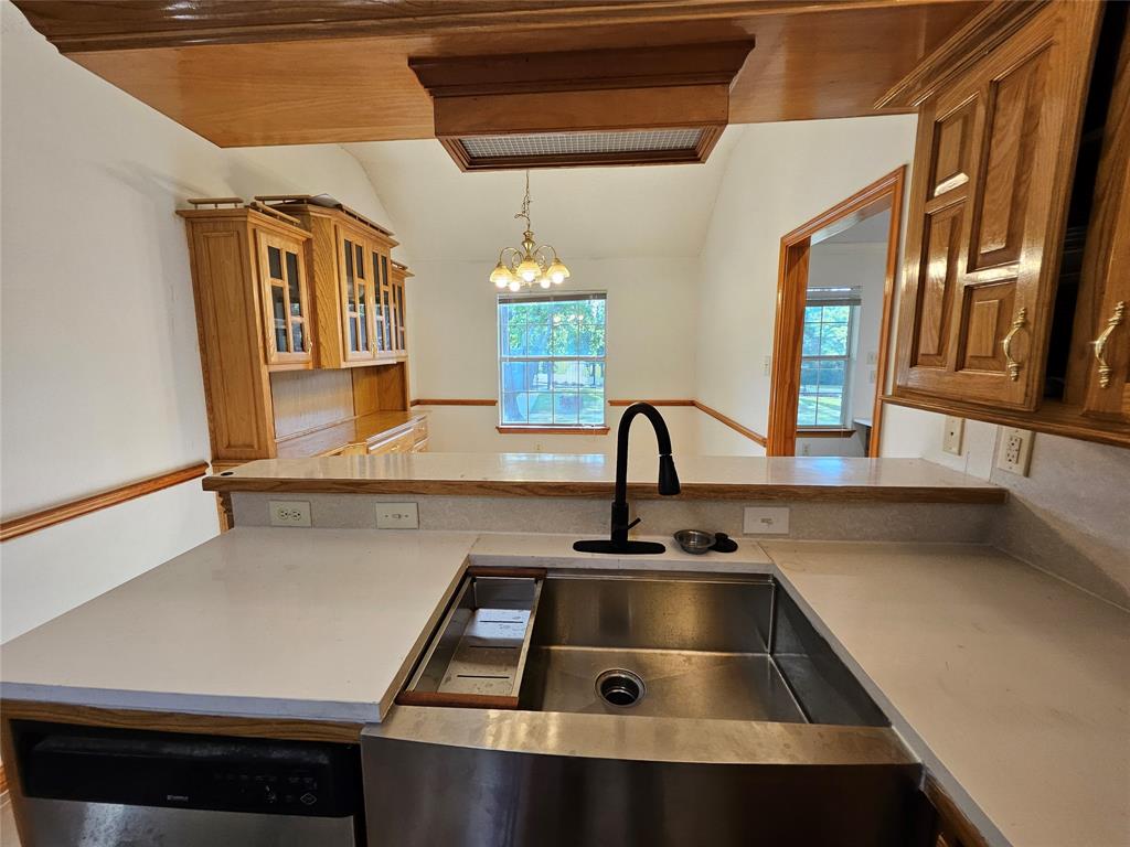 234 East Fork Road Sunnyvale, TX 75182 - Photo 8 of 32 a kitchen with a sink and a stove top oven
