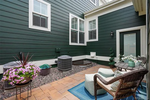 a outdoor living space with furniture and potted plants