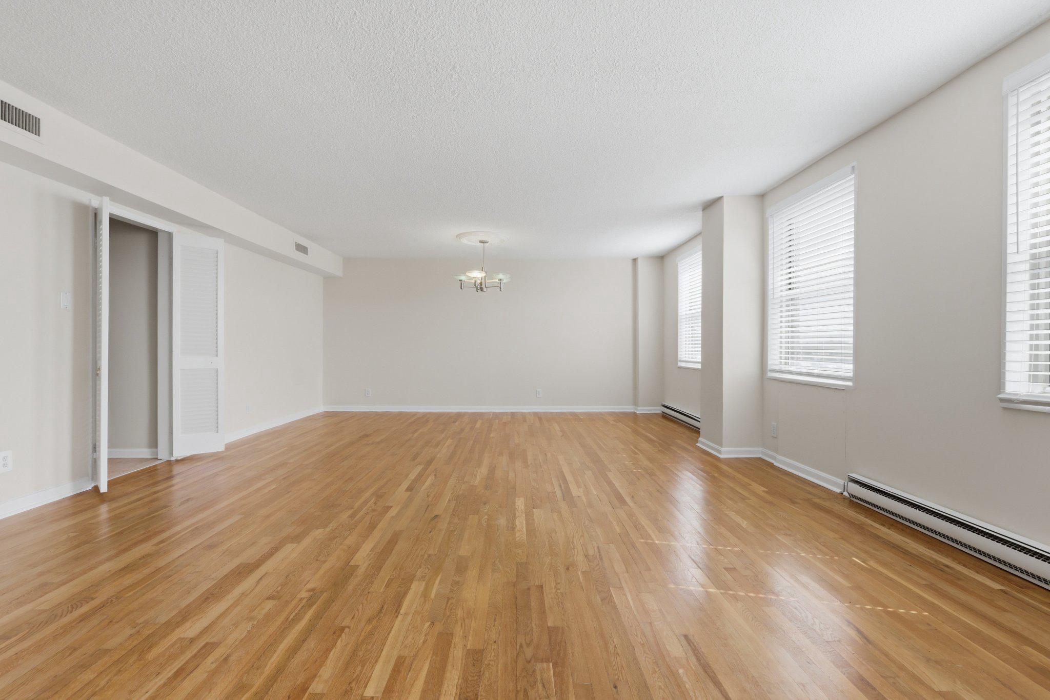 1101 St Paul Street, Unit 1212 Baltimore, MD 21202 - Photo 23 of 36 Spacious, sunlit open living/dining area.